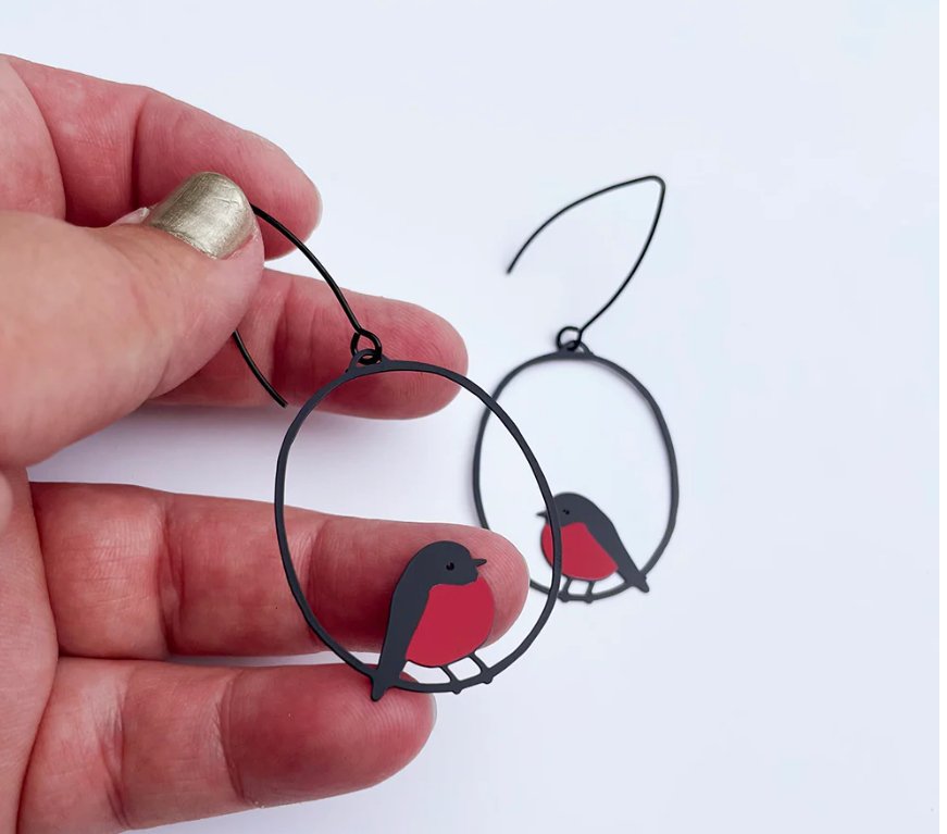 DENZ Midi Robin Earrings in Red and Black, held by hand