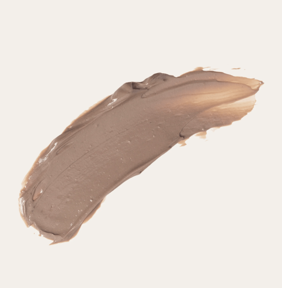Product swatch showing the rich texture and bronze skin-tone tint of Seed & Sprout reef-safe mineral sunscreen.