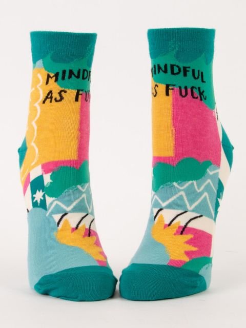 Front-facing studio view of a pair of Blue Q women's ankle socks featuring colorful geometric abstract art with black text reading "MINDFUL AS FUCK".