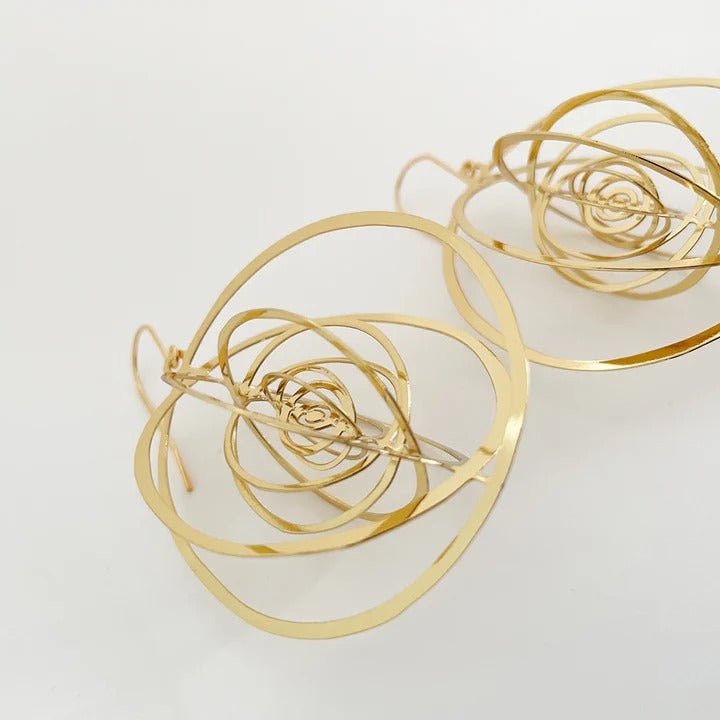DENZ Orbit (open) dangles in gold