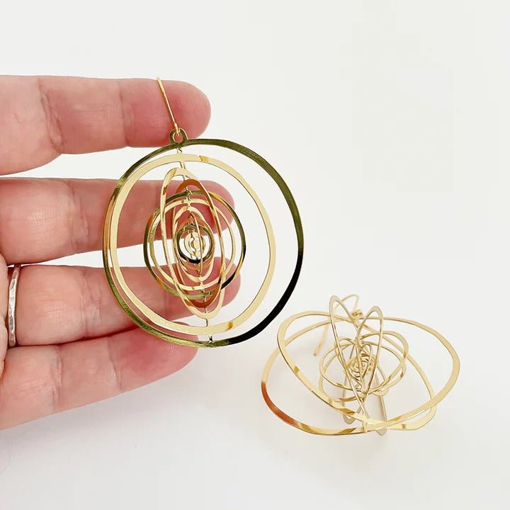 DENZ Orbit (open) dangles in gold