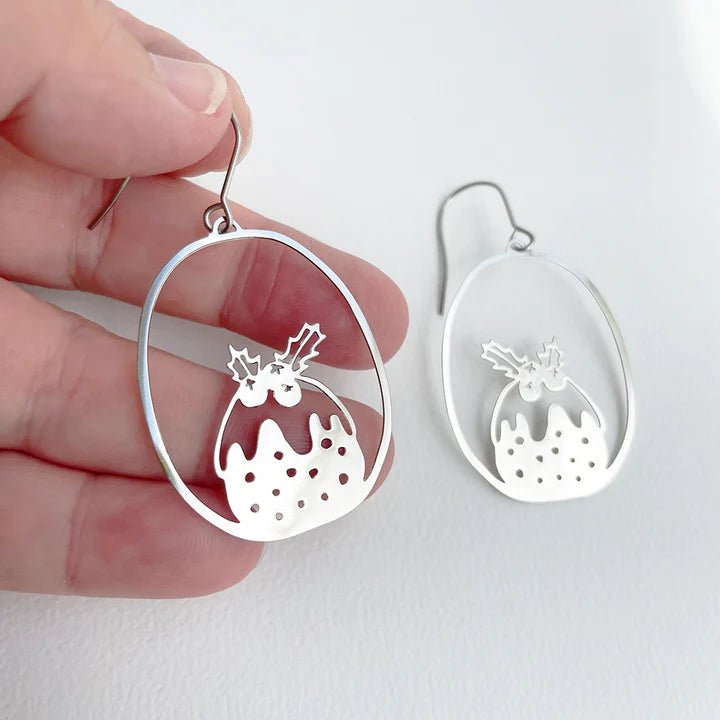 DENZ Mini Puddings in Silver earrings, held by hand
