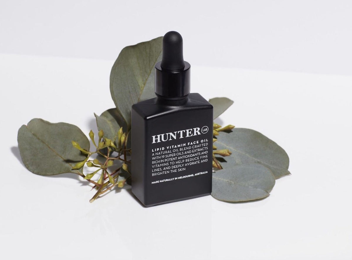 Hunter Lab Vitamin Face Oil Face and Body with dried leaves accent