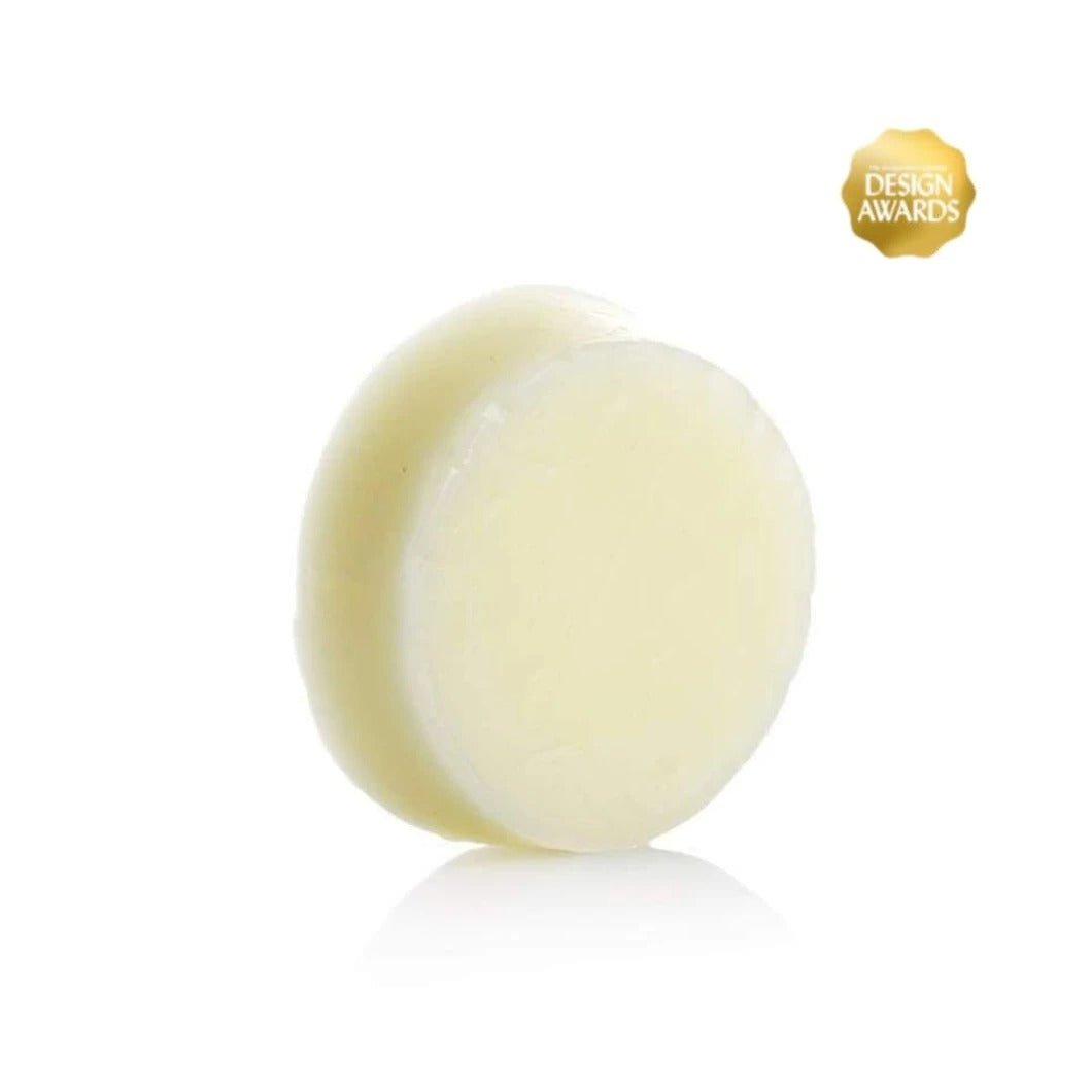 Seed & Sprout solid conditioner bar standing vertically on a white surface with a gold Design Awards seal in the top corner.