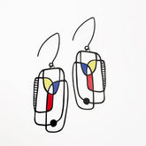 Pair of DENZ Art School Drop Out Earrings in Primary with geometric design on a white background