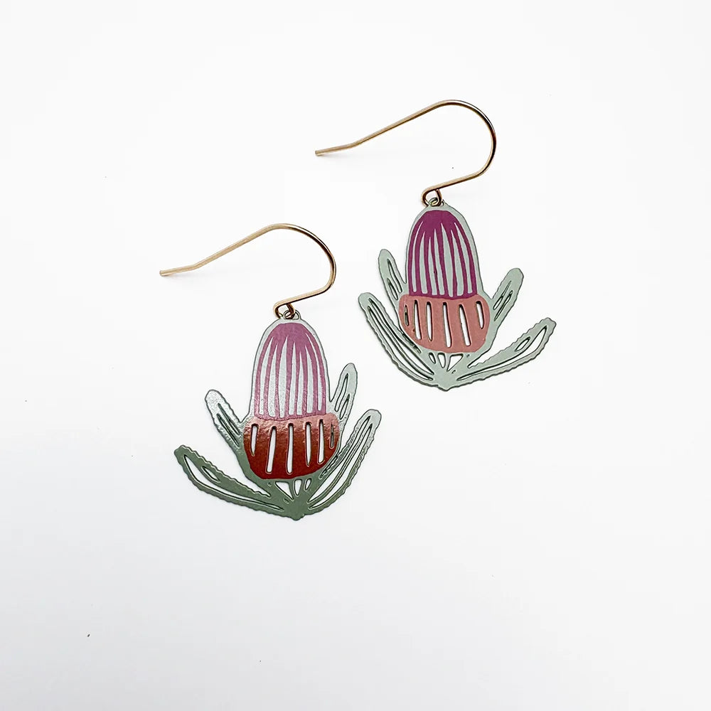 Pair of DENZ banksia flower earrings with sage, orange and wine design on a white background