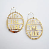 DENZ It's The Vibe earrings in gold with detailed patterned oval hoop in white background
