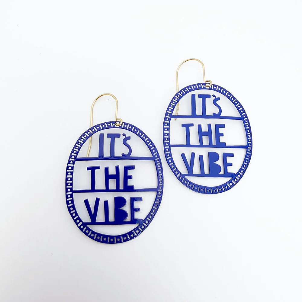 Round DENZ earrings with 'It's The Vibe' text on a white background