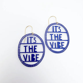 Round DENZ earrings with 'It's The Vibe' text on a white background