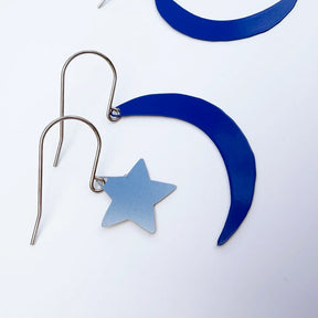 DENZ Moon & Star Stacker Silver-toned metal dangle earrings featuring a crescent moon and star design, shown on a clean white background.