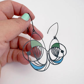 DENZ Art School Drop Out Earrings in Cool, held by hand