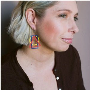 Side profile of a woman wearing Denz Basic Shape Earrings in Primarys 