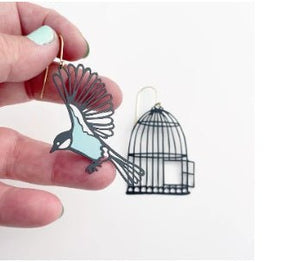 Denz Birdcage & Bird Earrings in Black & Duck Egg, held by hand
