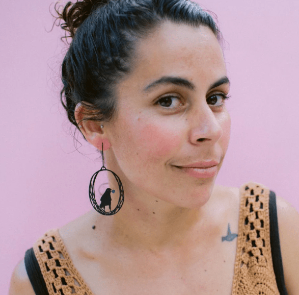 Woman wearing the DENZ Bowerbird earrings in Black/Blue 