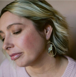 Side profile of a woman wearing Denz Bush Stone Curlew earrings in Brown