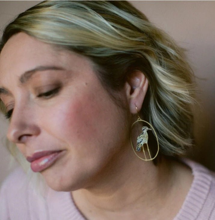Side profile of a woman wearing Denz Bush Stone Curlew earrings in Brown