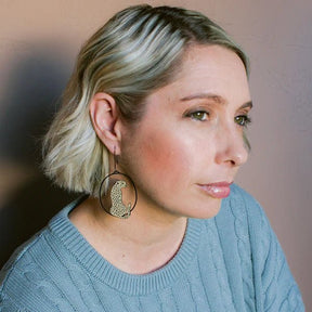 Side profile of a woman wearing Denz Cheetah earrings in Black/Tan Side 