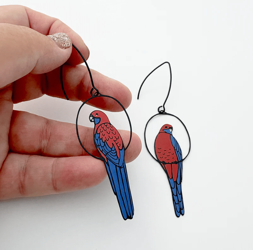 DENZ Crimson Rosella earrings, held by hand