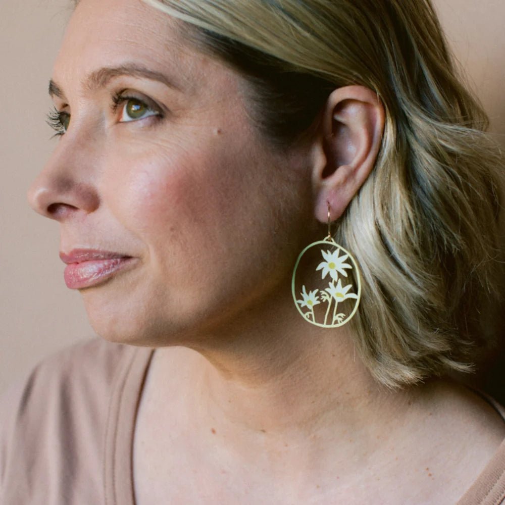 Woman wearing DENZ Flannel Flower Earrings in Lemon & Cream 