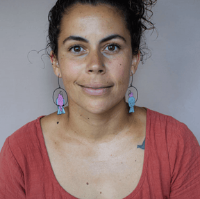 Woman wearing the DENZ Galah Earrings 