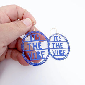 DENZ It's The Vibe Earrings in Indigo, held by hand