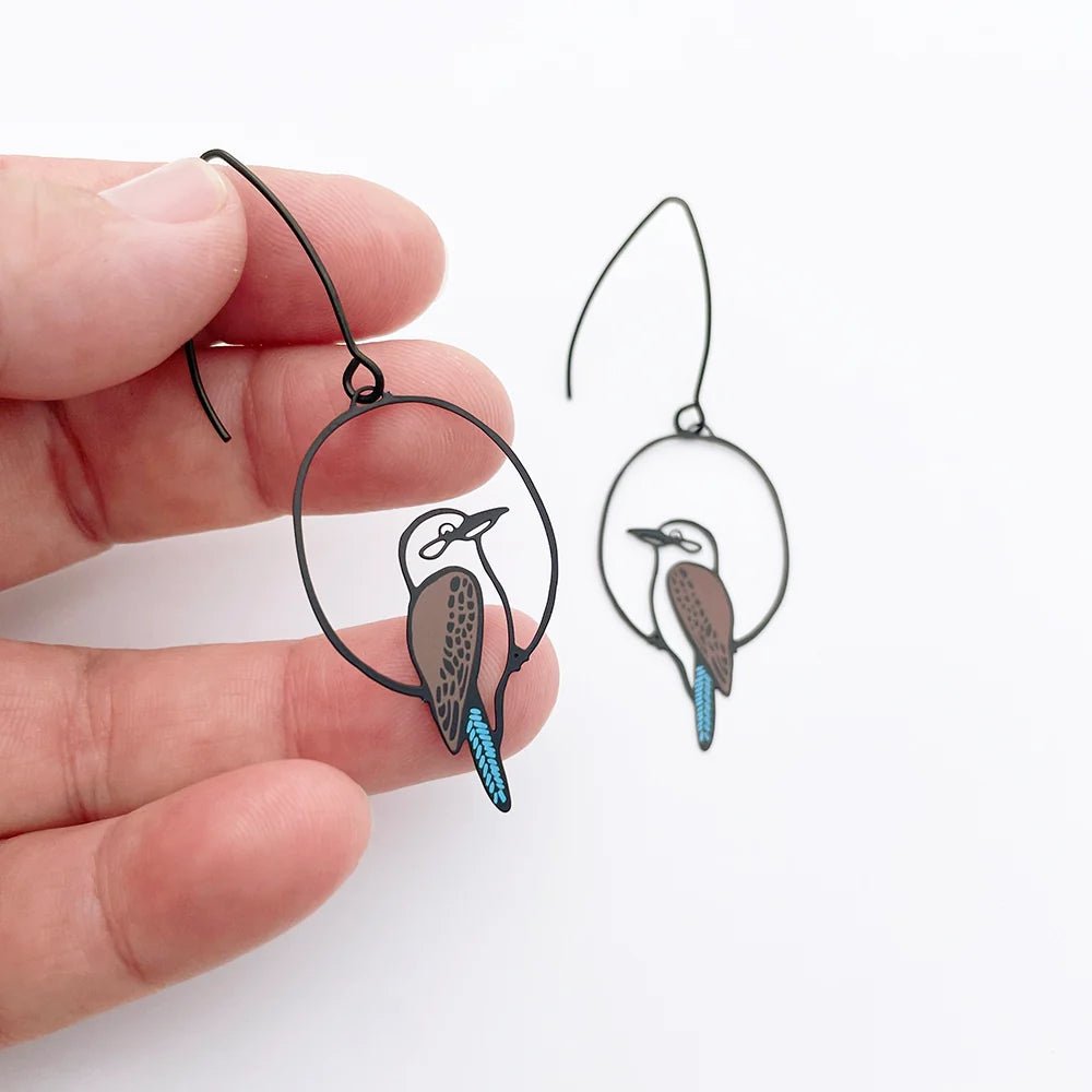 DENZ Kookaburra Earrings in Black, Brown & Blue, held by hand