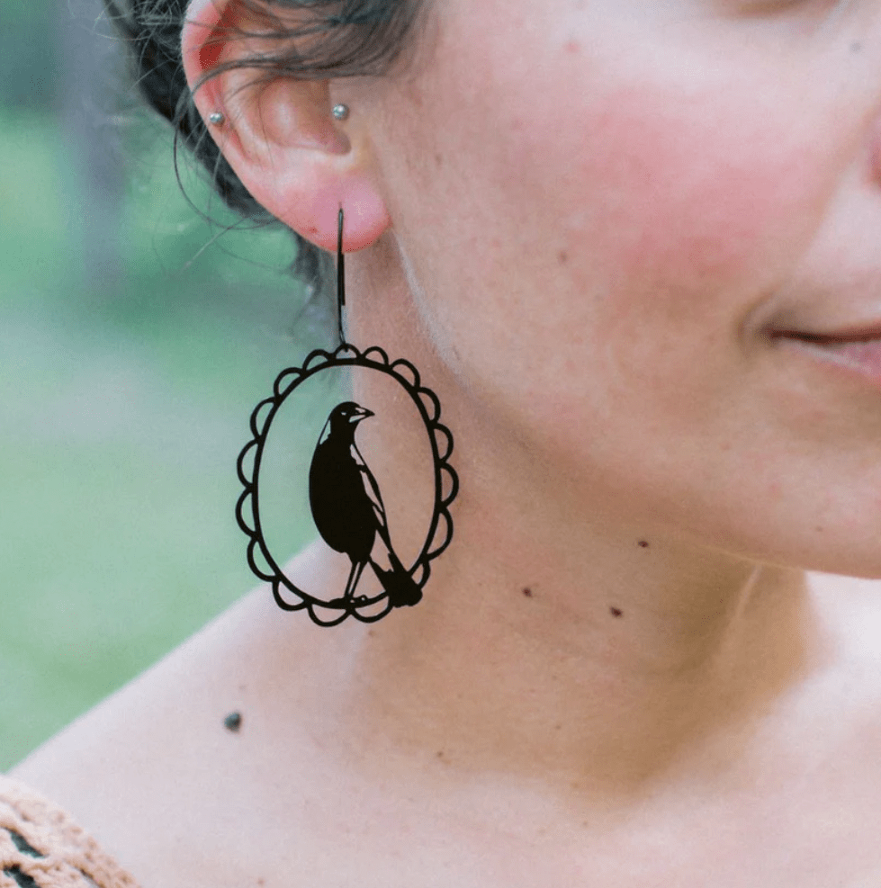 Side profile of a woman wearing the DENZ Magpie in Black 