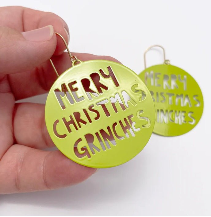 Denz Merry Christmas Grinches Earrings in Grinch Green, held by hand