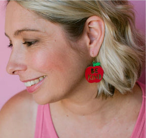 Side profile of a woman Denz Midi Be Kind Apple Earrings in Red/Green 