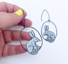 DENZ Midi Bilby Earrings in Black/Grey, held by hand