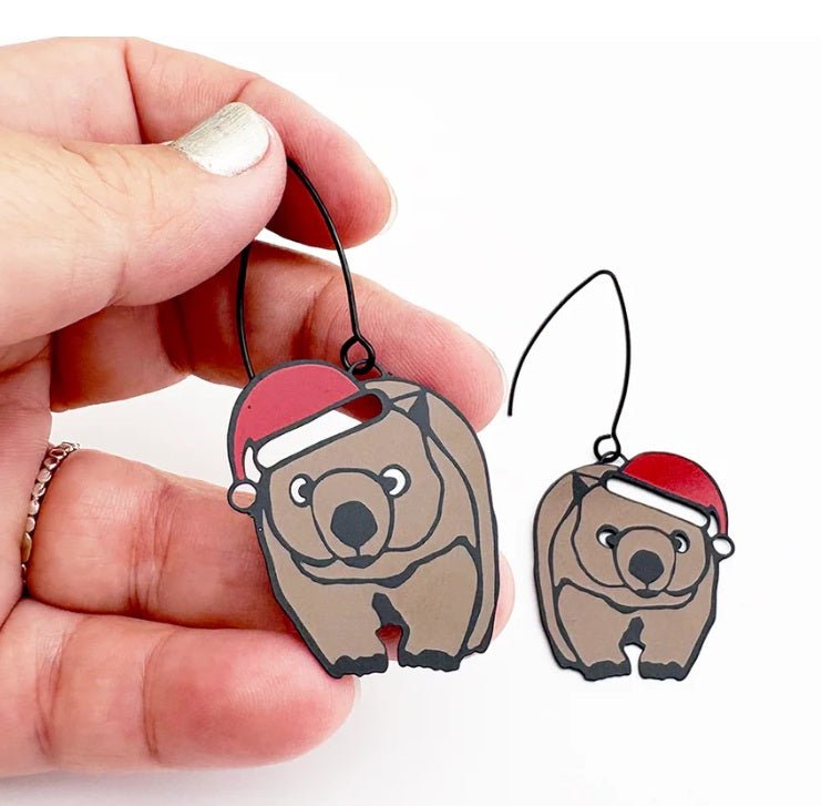 Denz Midi Christmas Wombat Earrings in Black/Brown/Red, held by hand