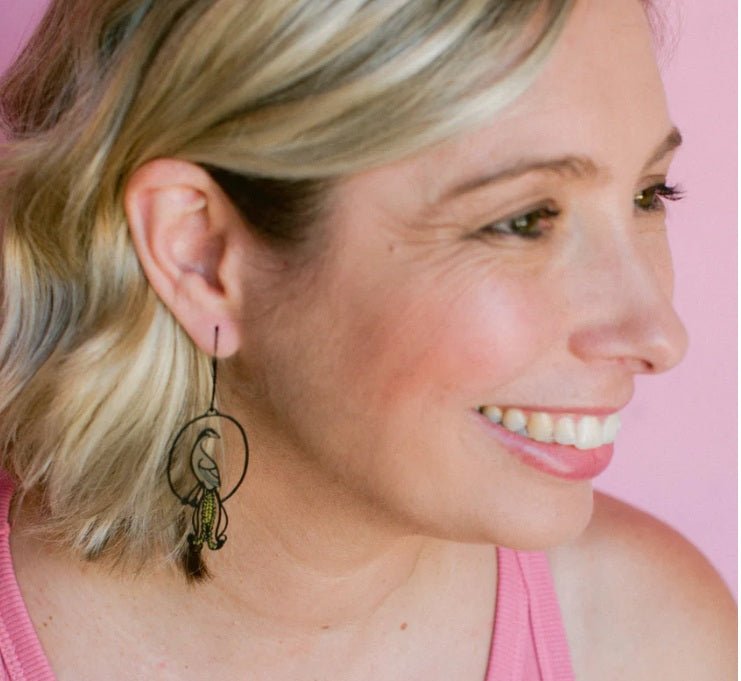 Side profile of a woman wearing Denz Midi Lyrebird Earrings in Black/Brown