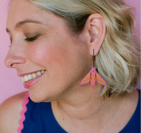 Side profile of a woman wearing a Denz Midi Moth Earrings in Elephant Hawk 