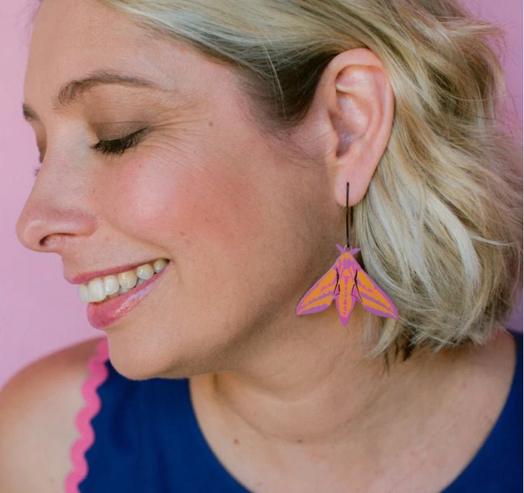 Side profile of a woman wearing a Denz Midi Moth Earrings in Elephant Hawk 