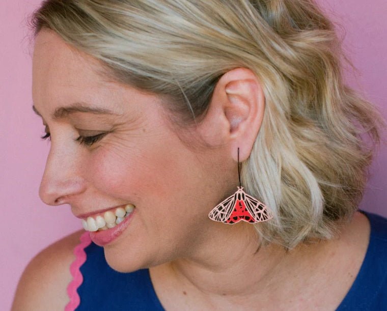Side profile of  a woman wearing a Denz Midi Moth Earrings in Ornate Tiger 
