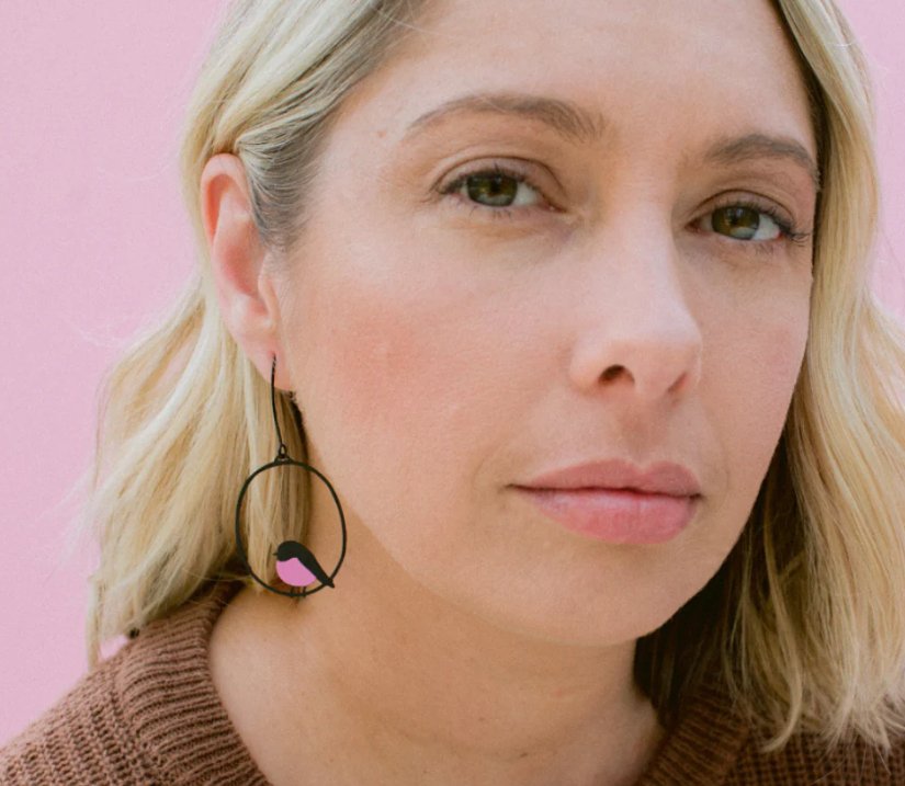 Woman is wearing the DENZ Midi Robin Earrings in Pink and Black 