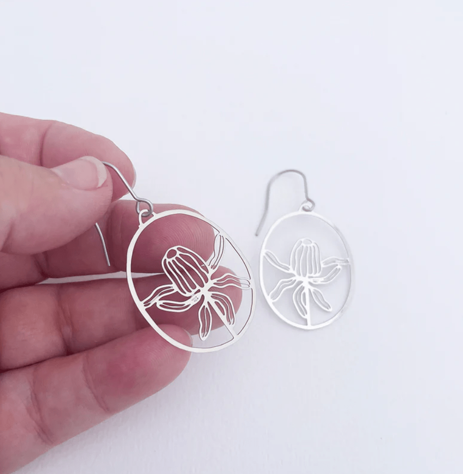 DENZ Mini Banksia Earrings in Silver, held by hand