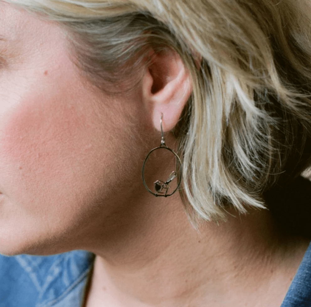 Woman wearing the DENZ Mini Fairy wren dangles in gold