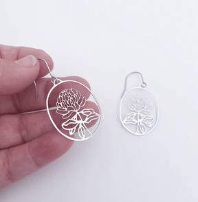 DENZ Mini Waratahs Earrings in Silver, held by hand