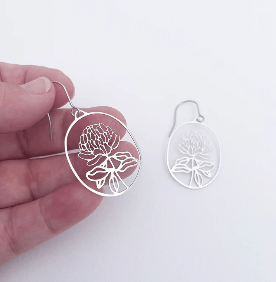 DENZ Mini Waratahs Earrings in Silver, held by hand