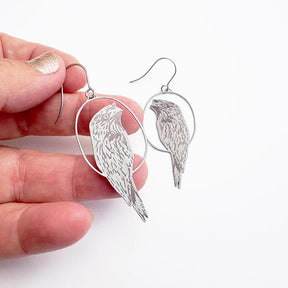 DENZ Tawny Frogmouth Earrings in Brown & Grey, held by hand
