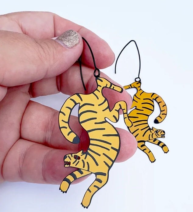Denz Tiger Earrings in Orange/Black, held by hand