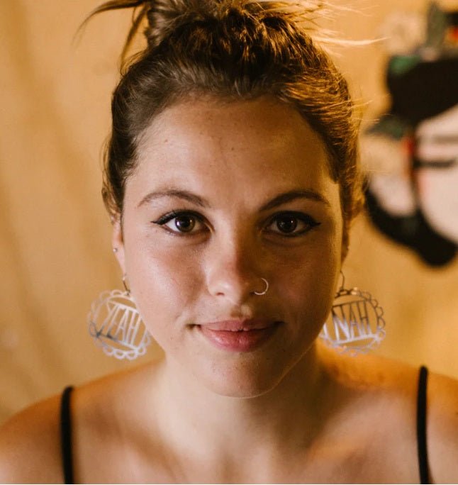 Woman wearing the DENZ YEAH NAH in Gold earrings 