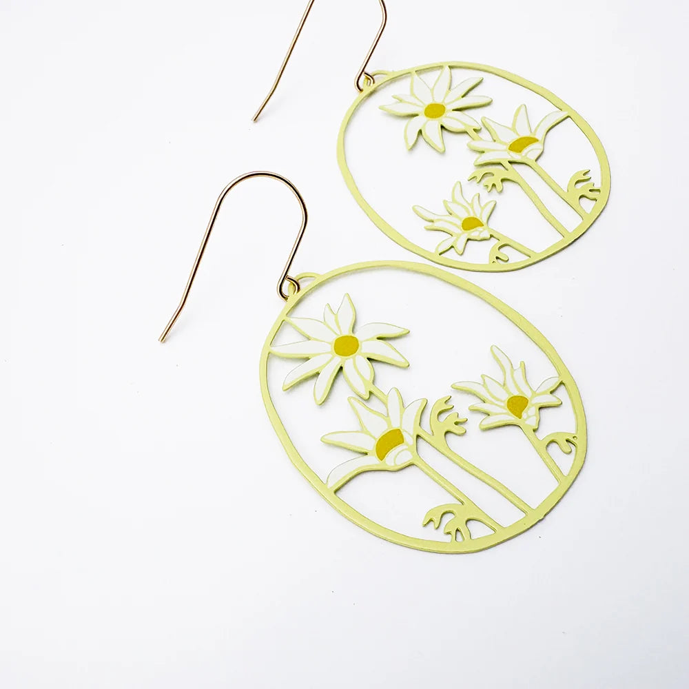 A pair of Flannel Flower earrings in Lemon & Cream with gold-tone fishhook wires, displayed on a clean white background.
