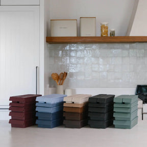 Seed & Sprout reusable silicone freezer trays stacked in multiple earthy colorways - including macadamia, blueberry, liquorice, and eucalyptus.