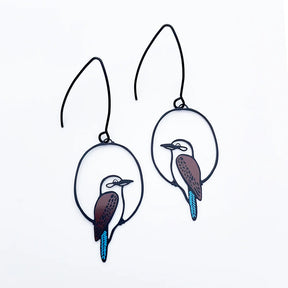 A pair of DENZ black metal wire hoop earrings featuring cutout kookaburra bird designs with brown, white, and bright blue accents, displayed on a clean white background.