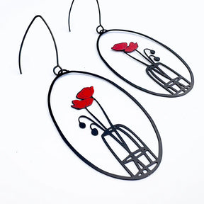 DENZ Poppy Vase Earrings with red flower and black vase design on a white background