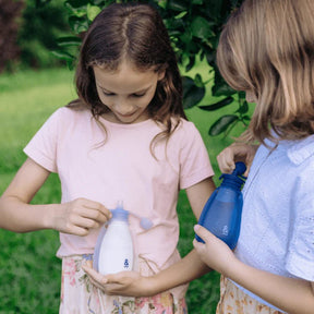 Kids holding Seed & Sprout Reusable Yoghurt Pouches Indigo, eco-friendly snack bag