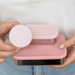 Seed & Sprout peoony leakproof silicone insert containers and pots for the CrunchBox bento lunch box, held by a person.