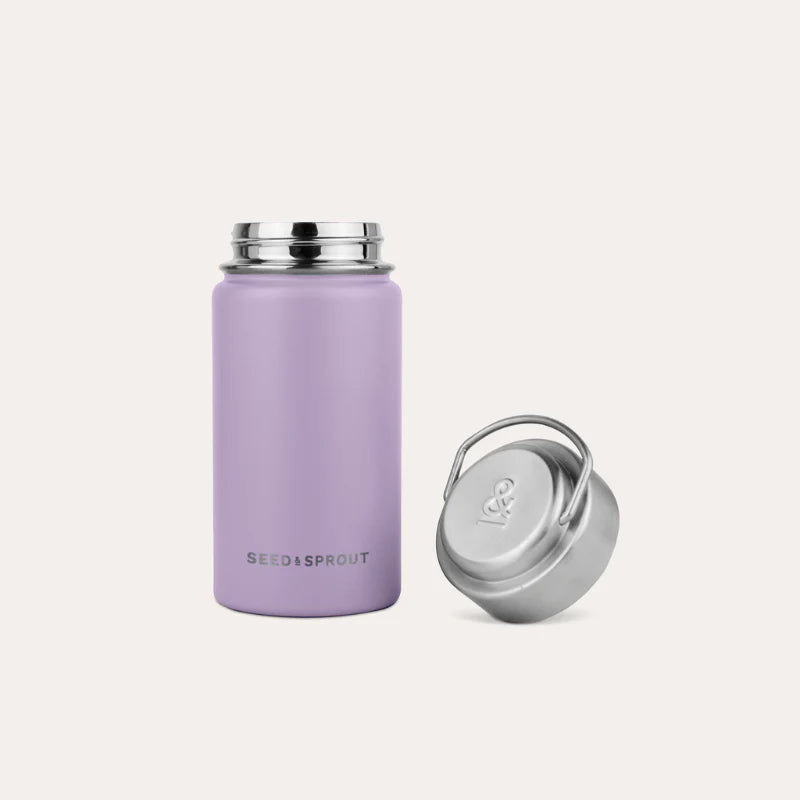 An open Seed and Sprout Durable 350ml Insulated Stainless Steel Drink Bottle in Plum standing upright next to its unscrewed silver cap.
